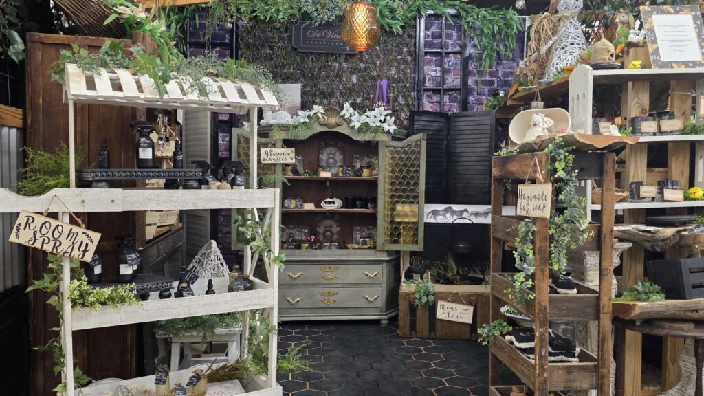Antique mall booth display using layered shelves and small items to create a full look without overcrowding