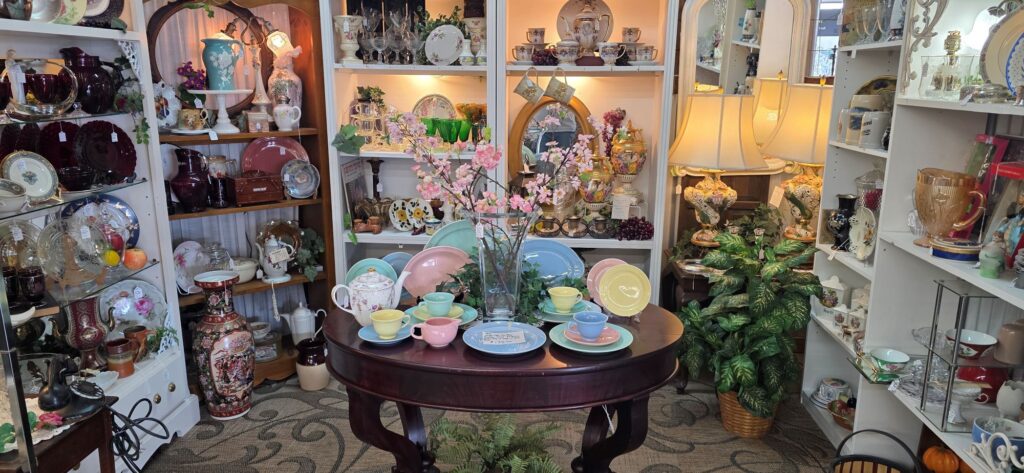 antique mall booth filled with vintage kitchenware and decor items