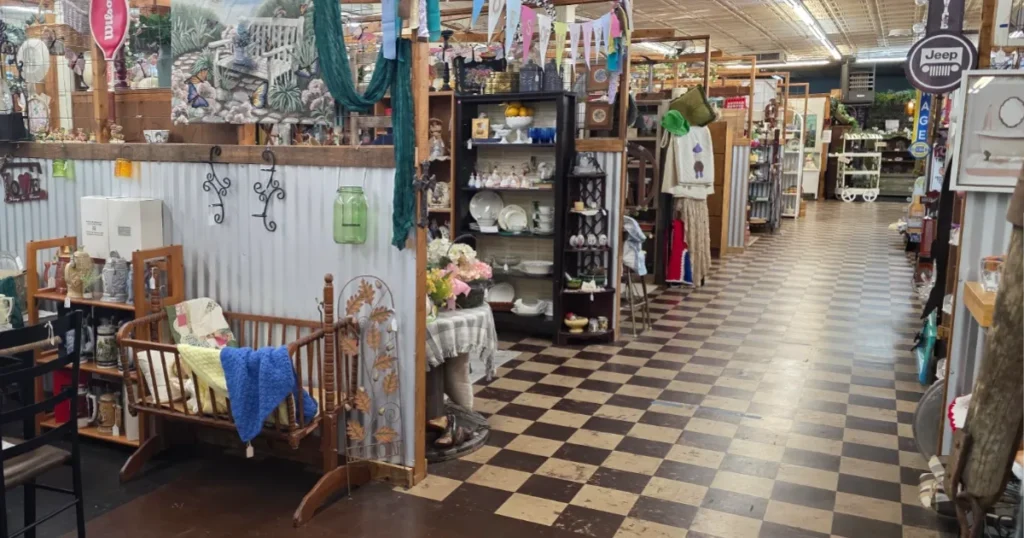an aisle of booths at an antique mall