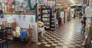 an aisle of booths at an antique mall